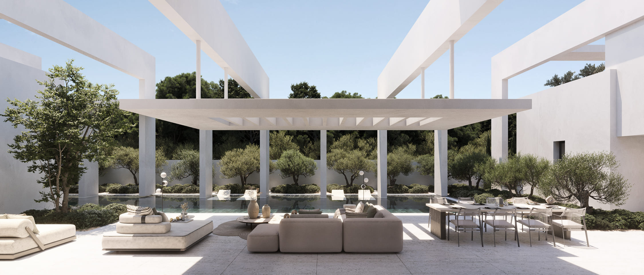 Patio interior con pérgola de arcos y zona de estar exterior rodeada de vegetación mediterránea