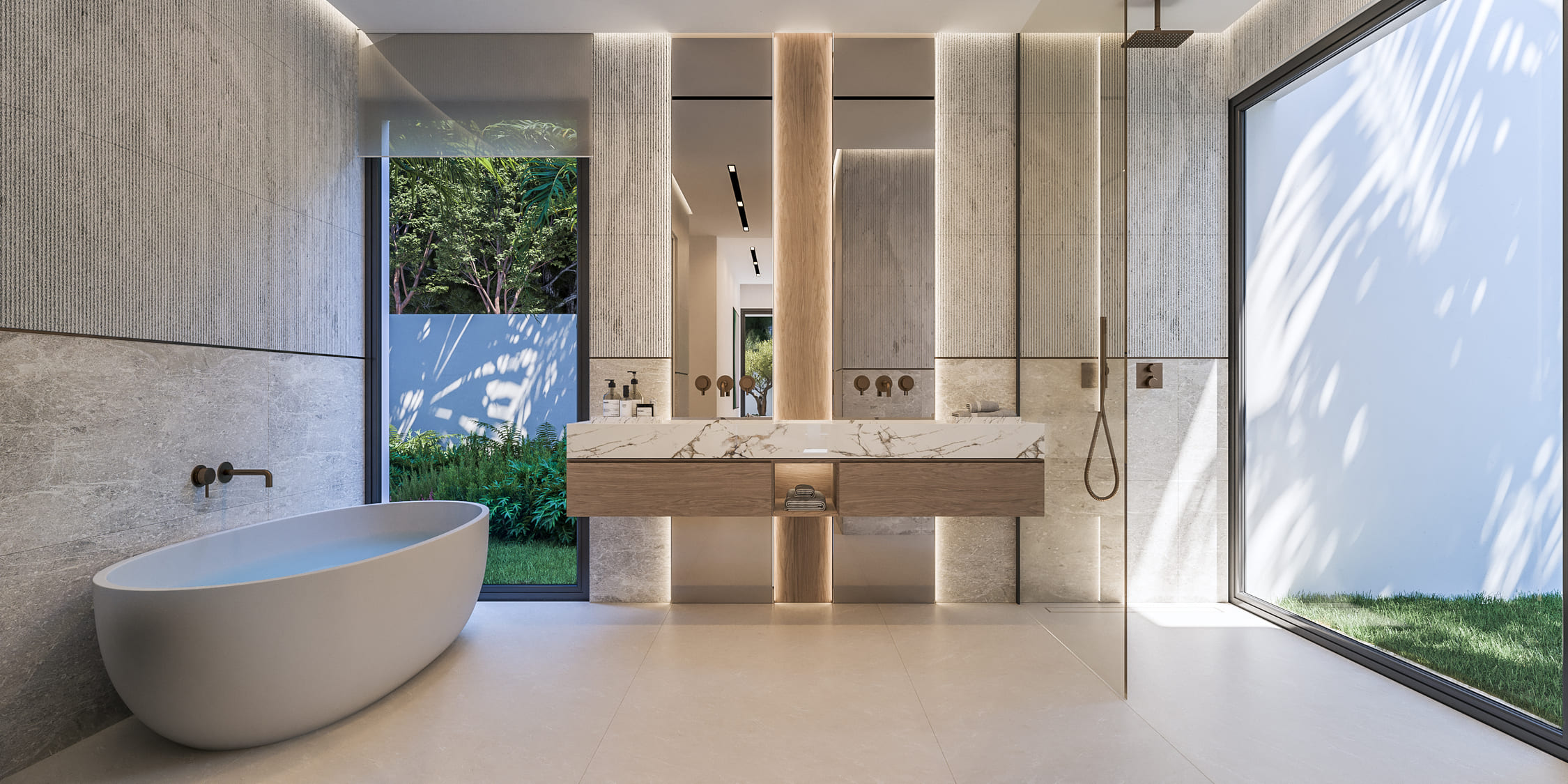 Baño principal con bañera exenta frente a un ventanal que da al jardin en la villa de Mijas