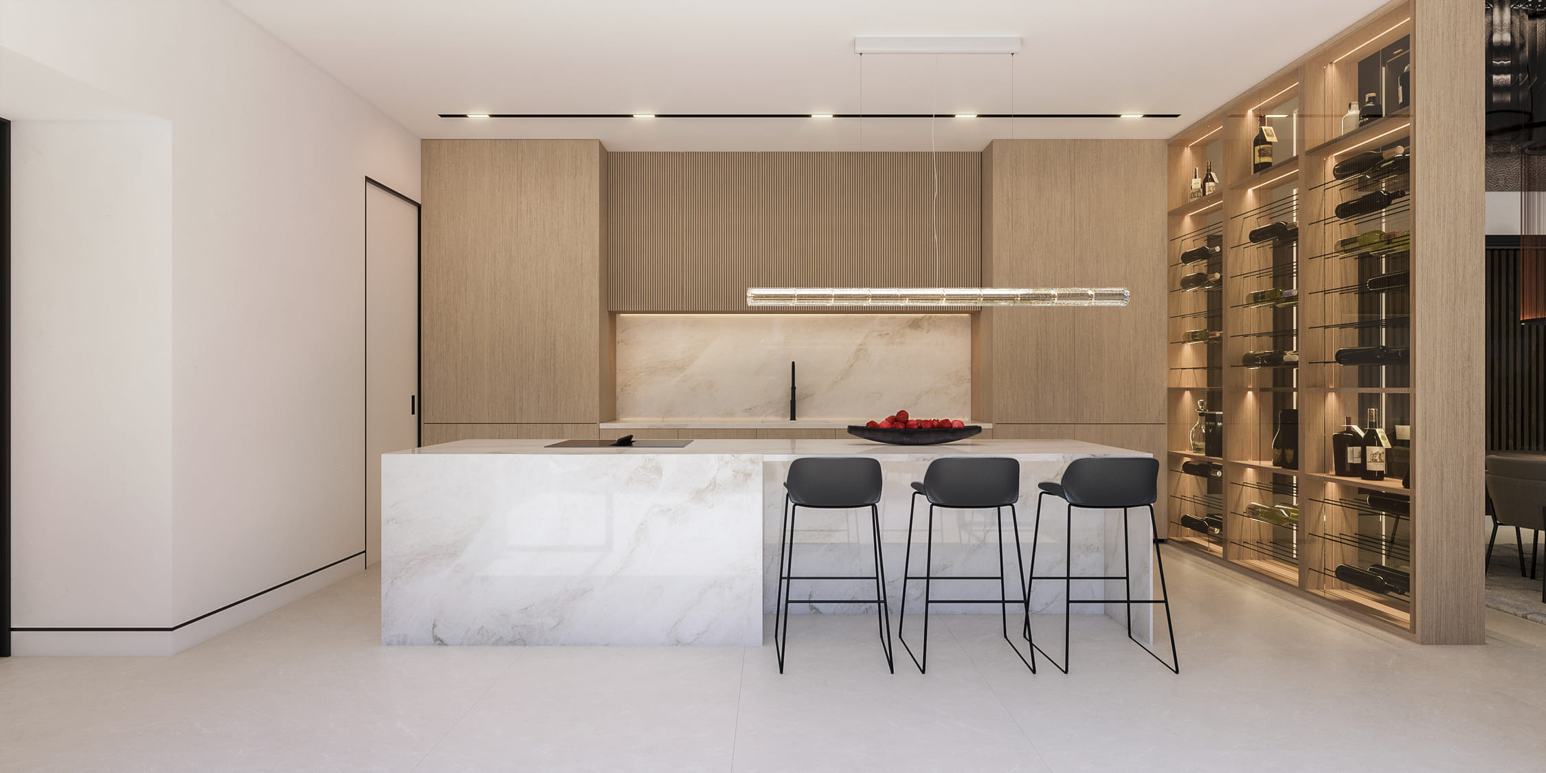 Cocina abierta con isla central, encimeras blancas y mobiliario de madera natural